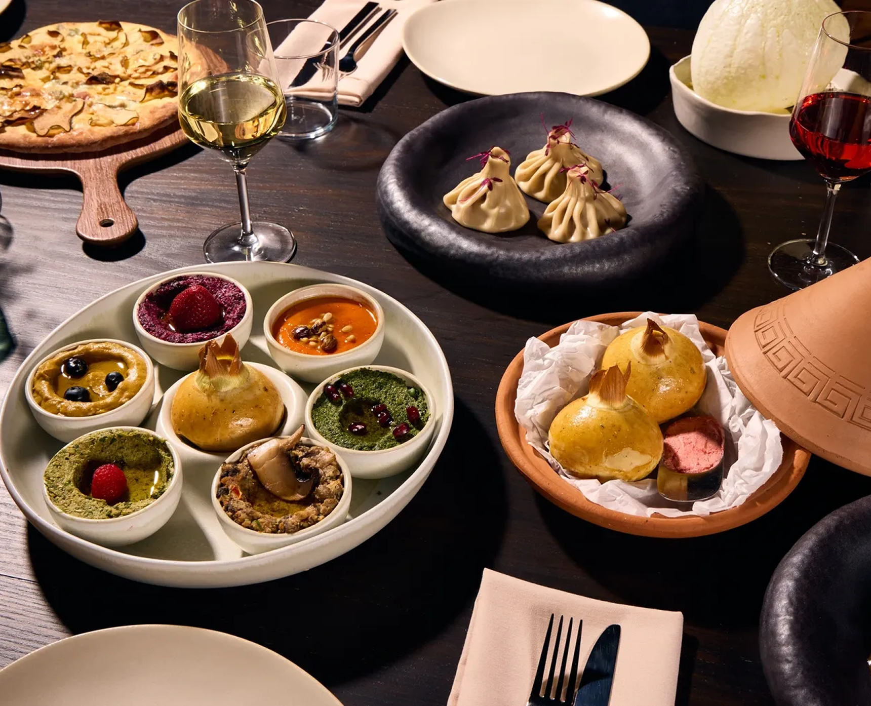 Assorted dishes and beverages on a table.